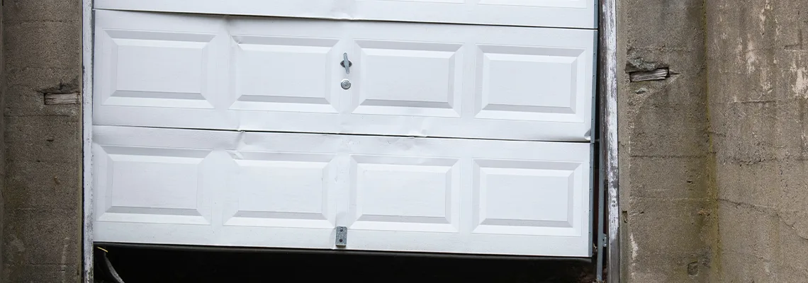 Garage Door Got Hit By A Car Dent Removal in North Port, FL